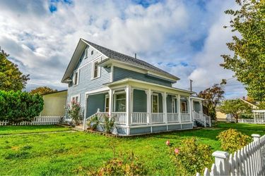 blue country home with deck