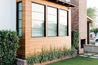 brick house with garden outside windows