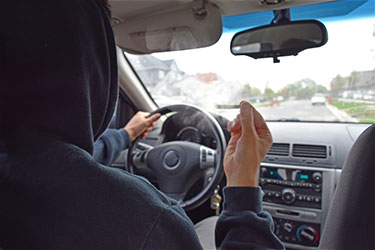 man smoking a joint while driving 