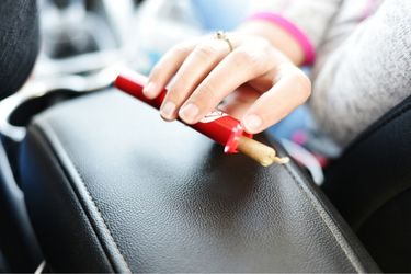 woman holding cannabis joint in rude tube