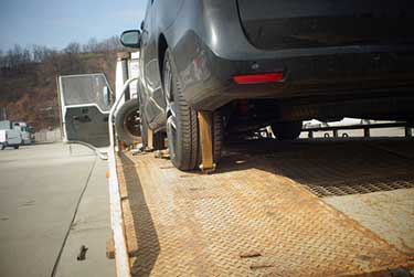 car being moved by a tow truck