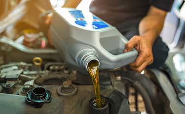 Oil being put into vehicle