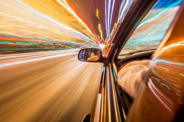 car speeding on road