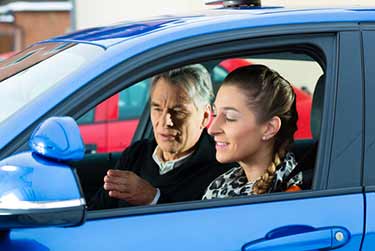 Young woman doing driving test