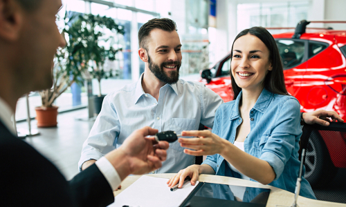 Car Saleswoman talking to a buyer