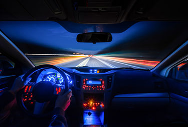 inside a car driving at night