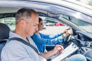 young woman after passing driving test