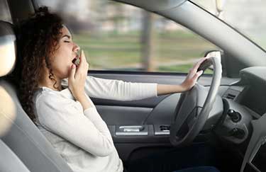 Woman Falling Asleep While Driving