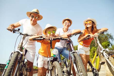 Family standing with bikes