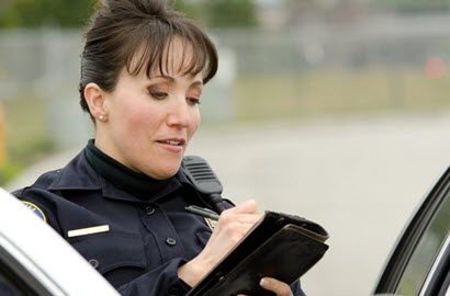 Female police officer writing a ticket