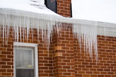 brick house with ice damming
