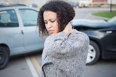 Person standing in front of accident