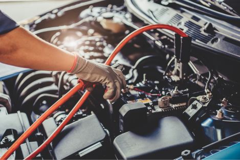 Jumper cables connected to car