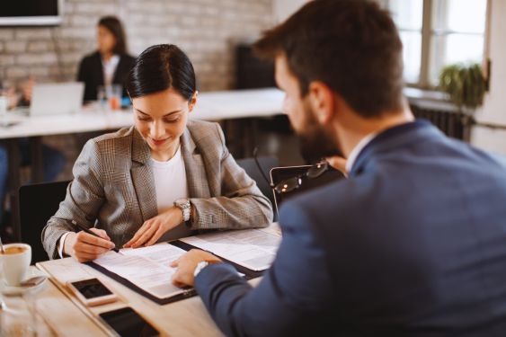 loan being signed by a woman