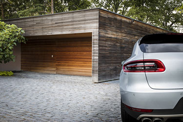 silver car parked beside garage