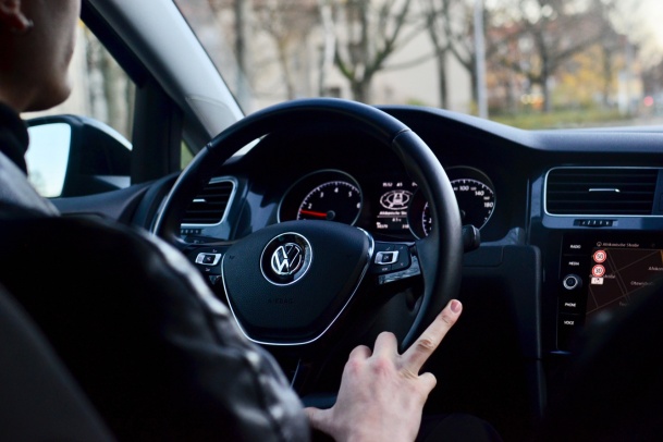 interior image of man driving a VW