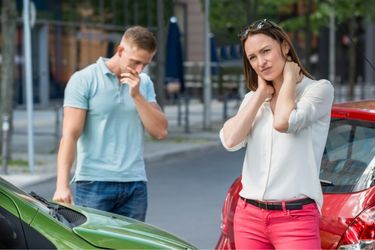 man and woman after a car accident