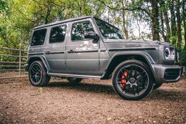 Mercedes parked in forest