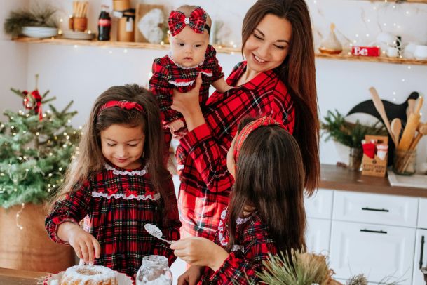 Mom and three kids in plaid on Christmas holidays
