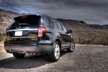 SUV parked with mountains