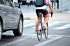 Cyclist on the road beside car