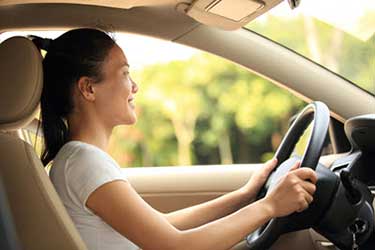 young woman driving a car