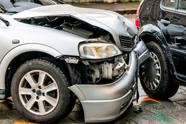 damaged silver car from an accident