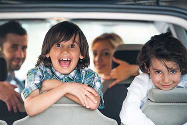 young family in a suv