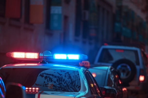 Young excited woman in a car