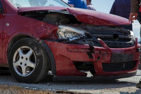 red car front bumpoer damaged from an accident