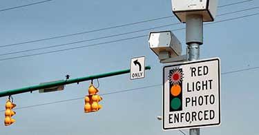 red light camera photo enforced sign