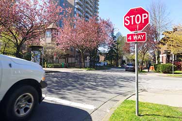 White vehicle at a stop sign