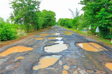 country road with many potholes