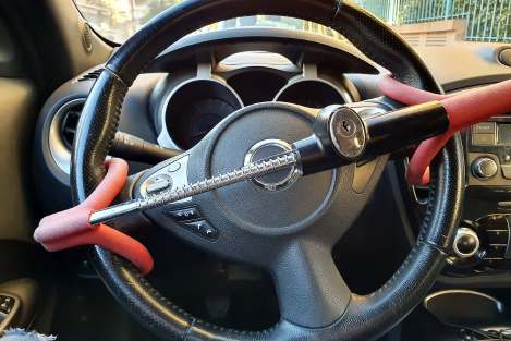 red steering wheel lock inside car
