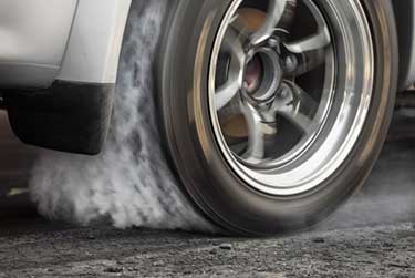 Car tire spinning doing a burnout