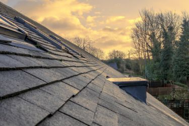 sunset behind roof