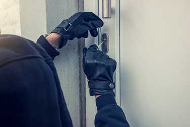 person breaking into a house