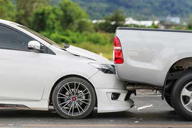 car rear ending a pickup truck