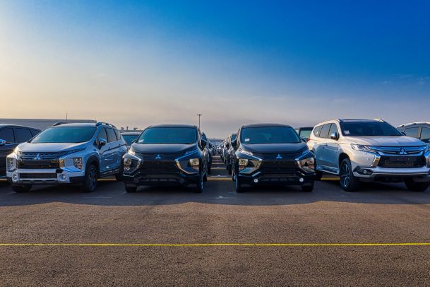 vehicles lined up for sale at a car dealership