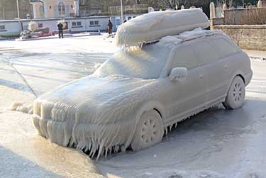 Vehicle covered in frost and snow from winter storm