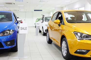 Automobile showroom with blue and yellow vehicles