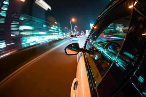 white car driving at night