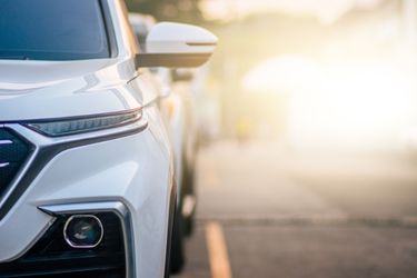 parked white car on the road