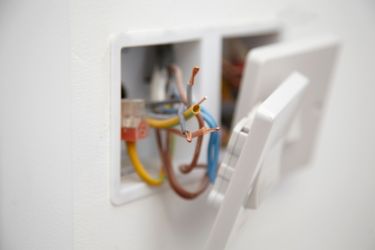 white electrical unit on wall