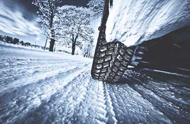 Winter tire on snow packed road