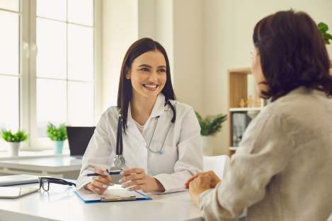 woman doctor speaking with patient